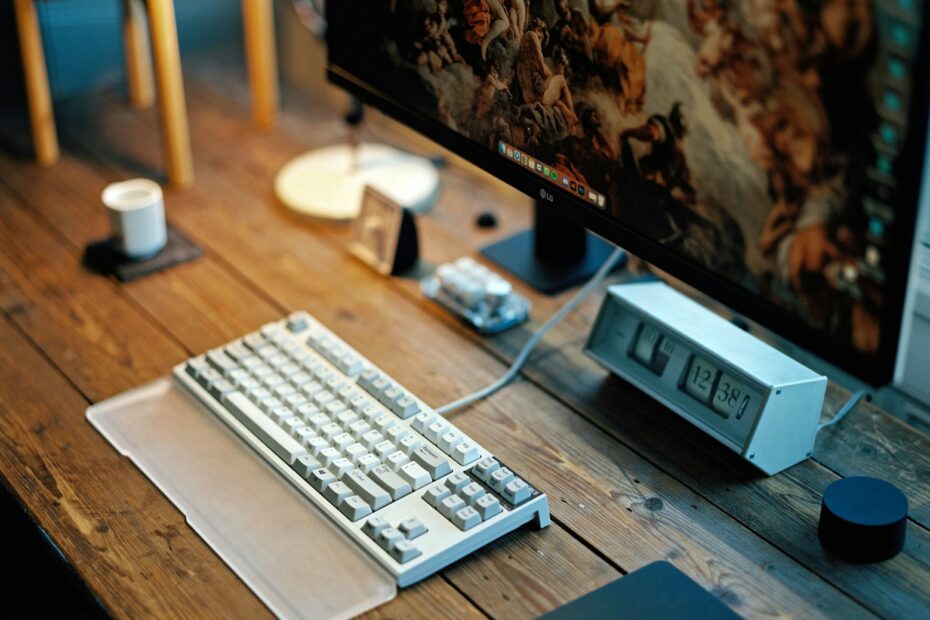 a desktop computer sitting on top of a wooden desk